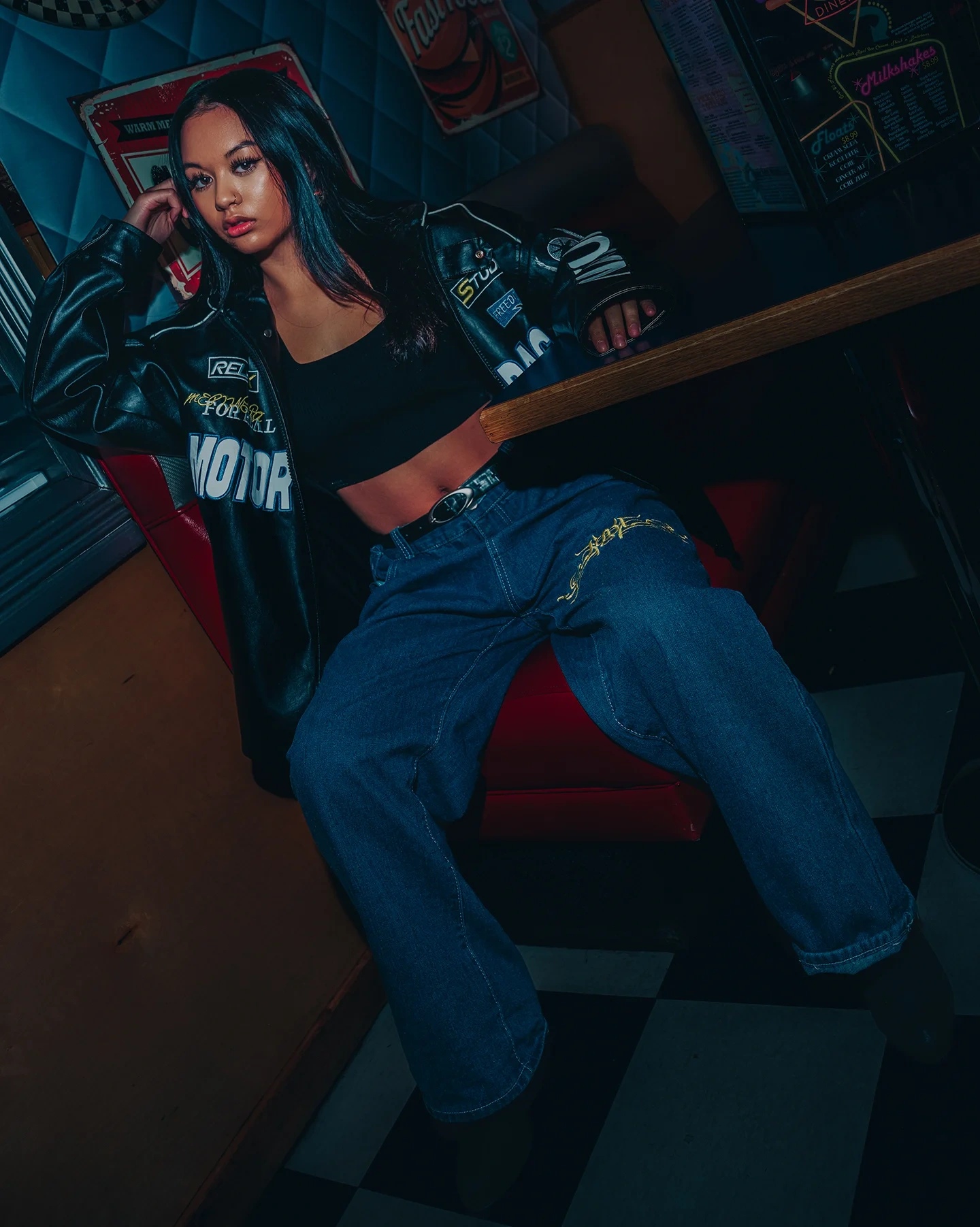 Diner booth portrait of Rachelle in editorial styling