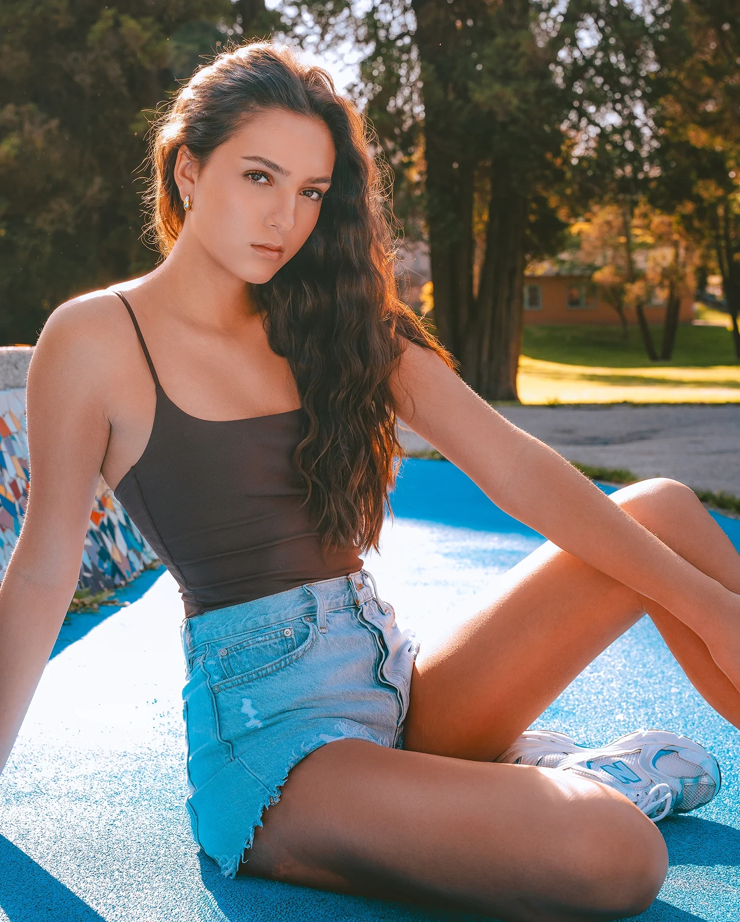 Daniela full-length editorial shot on outdoor tennis court