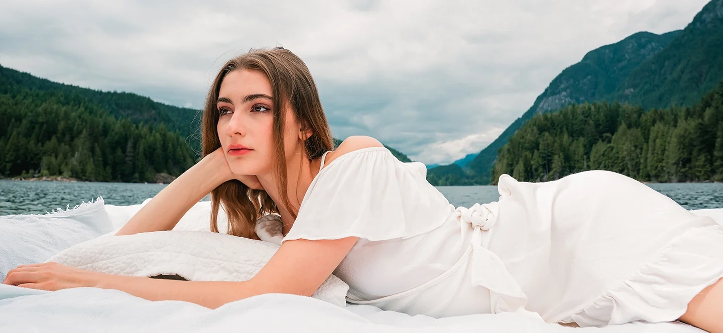 Outdoor editorial frame of Michaela and Kolbi under overcast sky